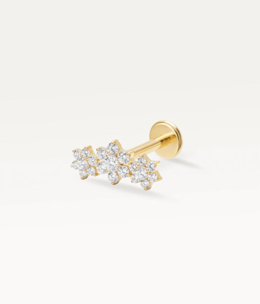 Piercing doré motif constellation florale serti de multiples zircons scintillants