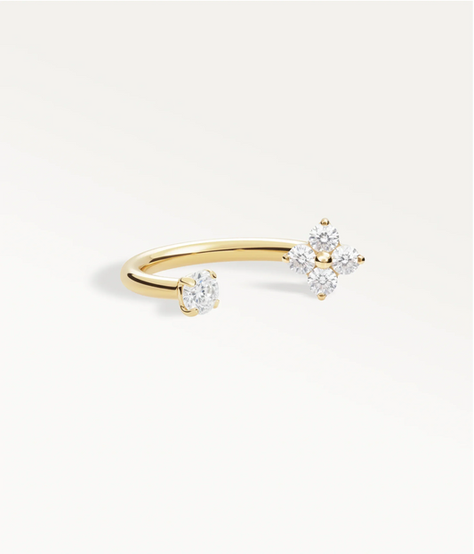 Open gold-tone Espoir piercing jewellery with a clover of stones and a solitaire stone at its ends.