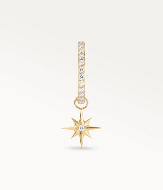 Gold-tone Lueur hoop set with stones and an eight-pointed star pendant, front view.