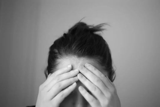Headache touching forehead scaled