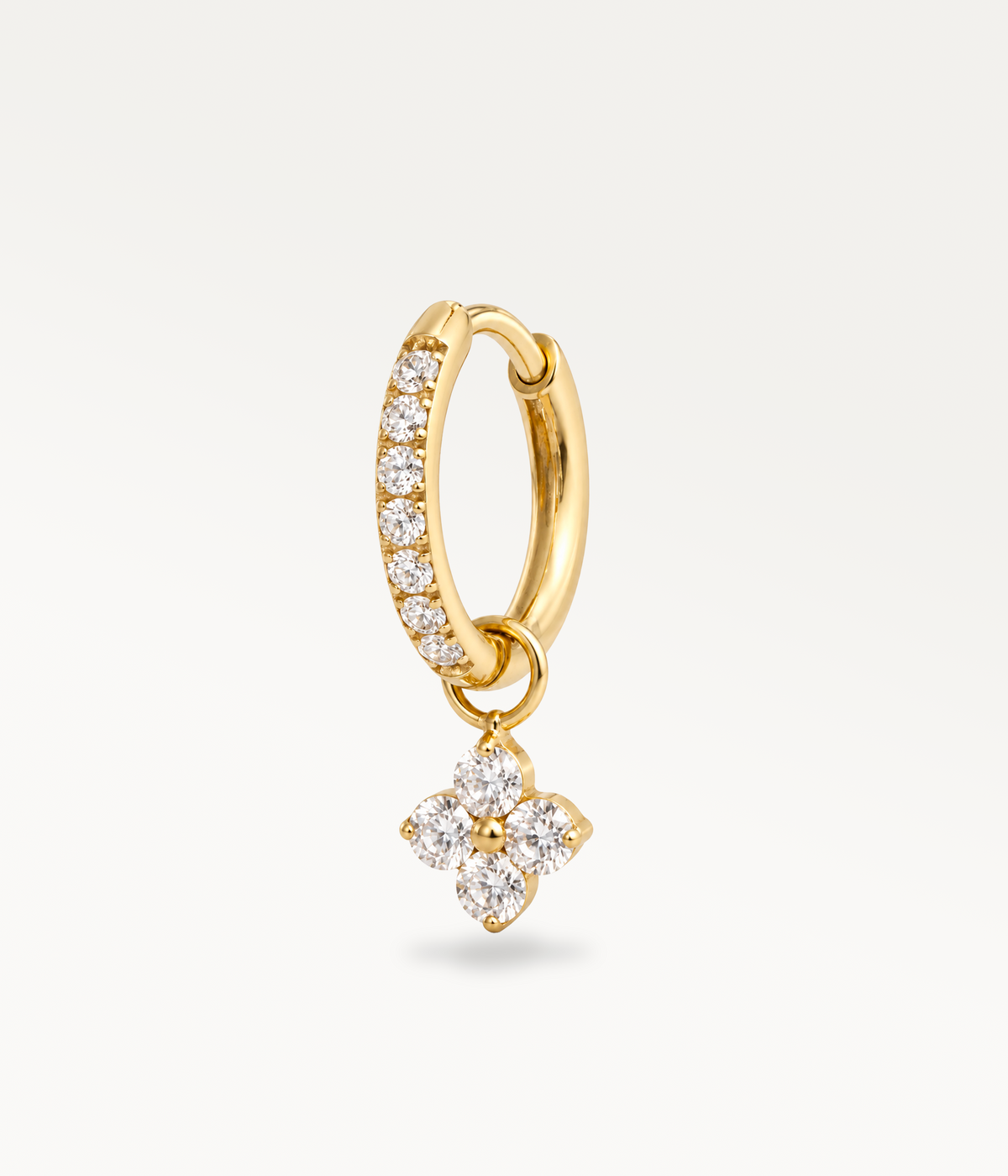 Gold-tone Poésie hoop earring with rhinestones and a four-stone pendant, three-quarter view.