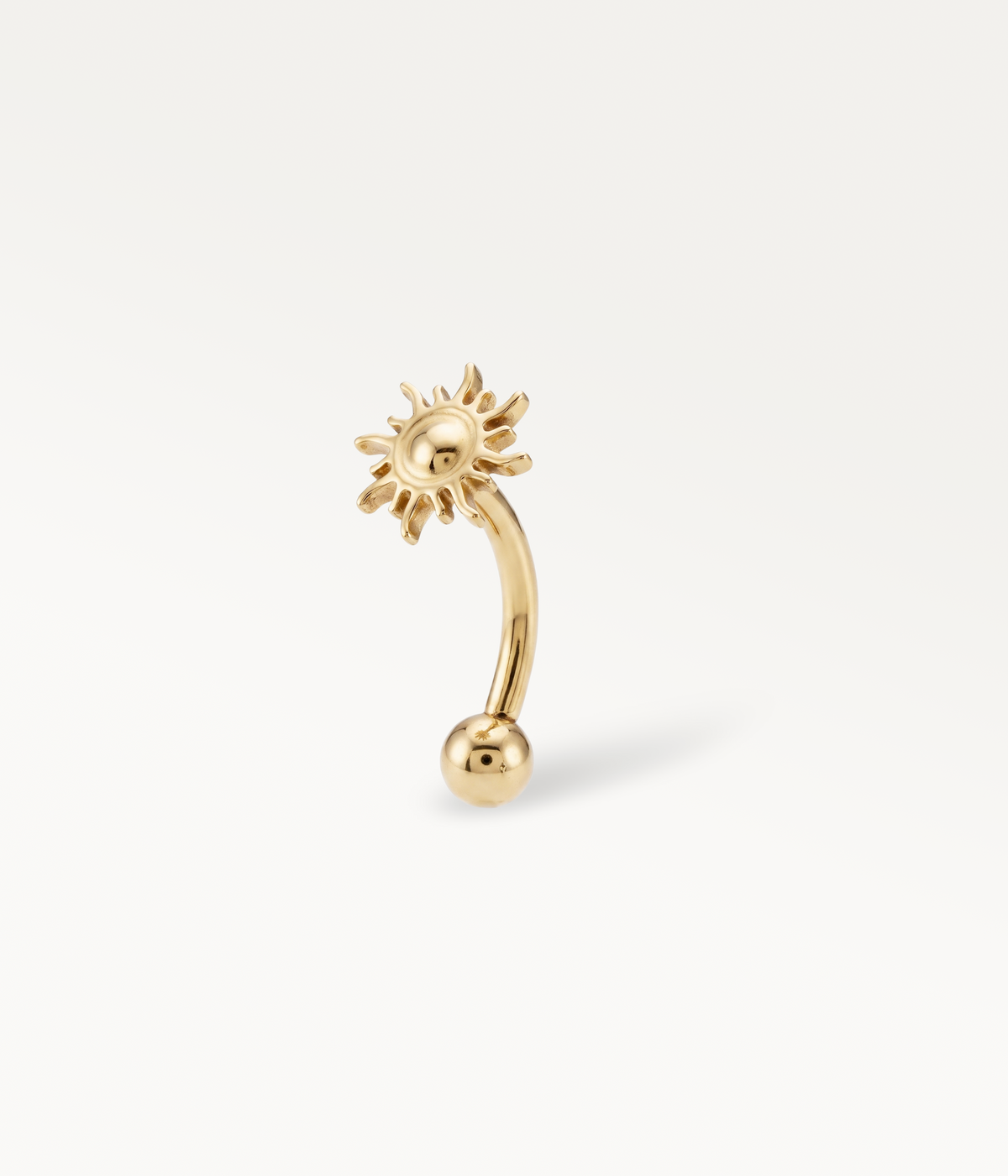 Gold-tone Helios Banane, sun on a curved post with a lower ball, side view.