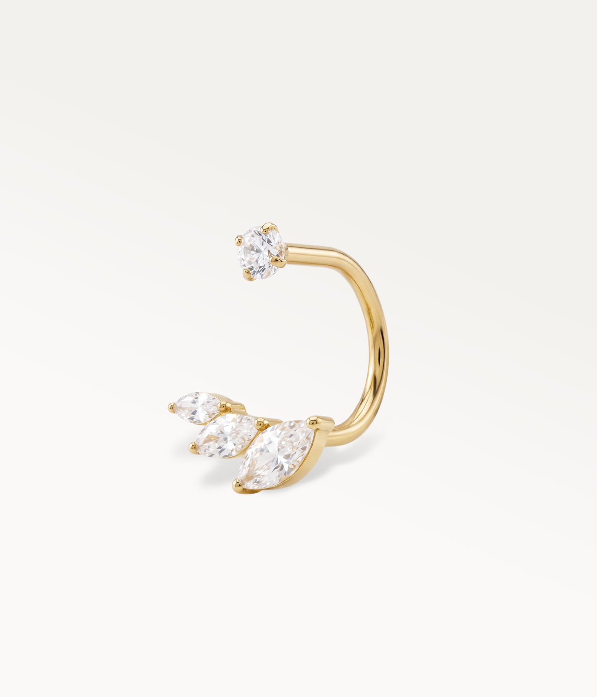 Gold-tone Eclat earring, an open hoop between a round stone and three marquise-shaped stones.