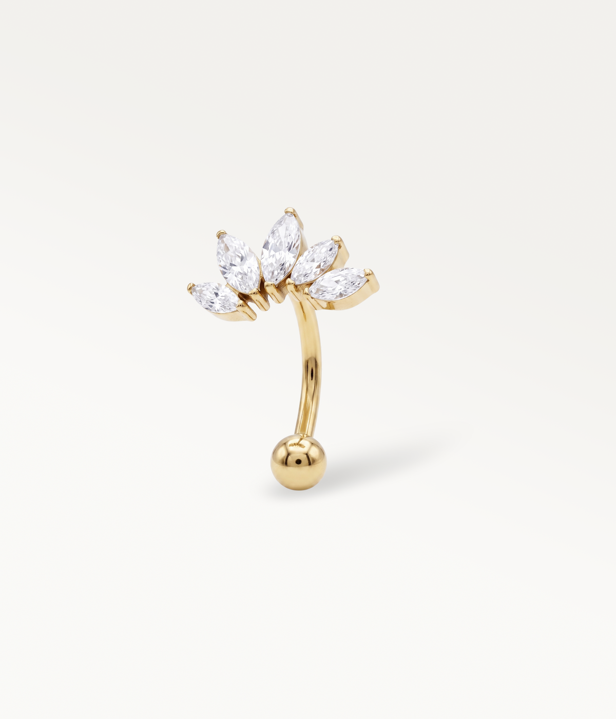 Diadème doré, piercing courbe couronné de pierres marquise, vue de trois quarts.