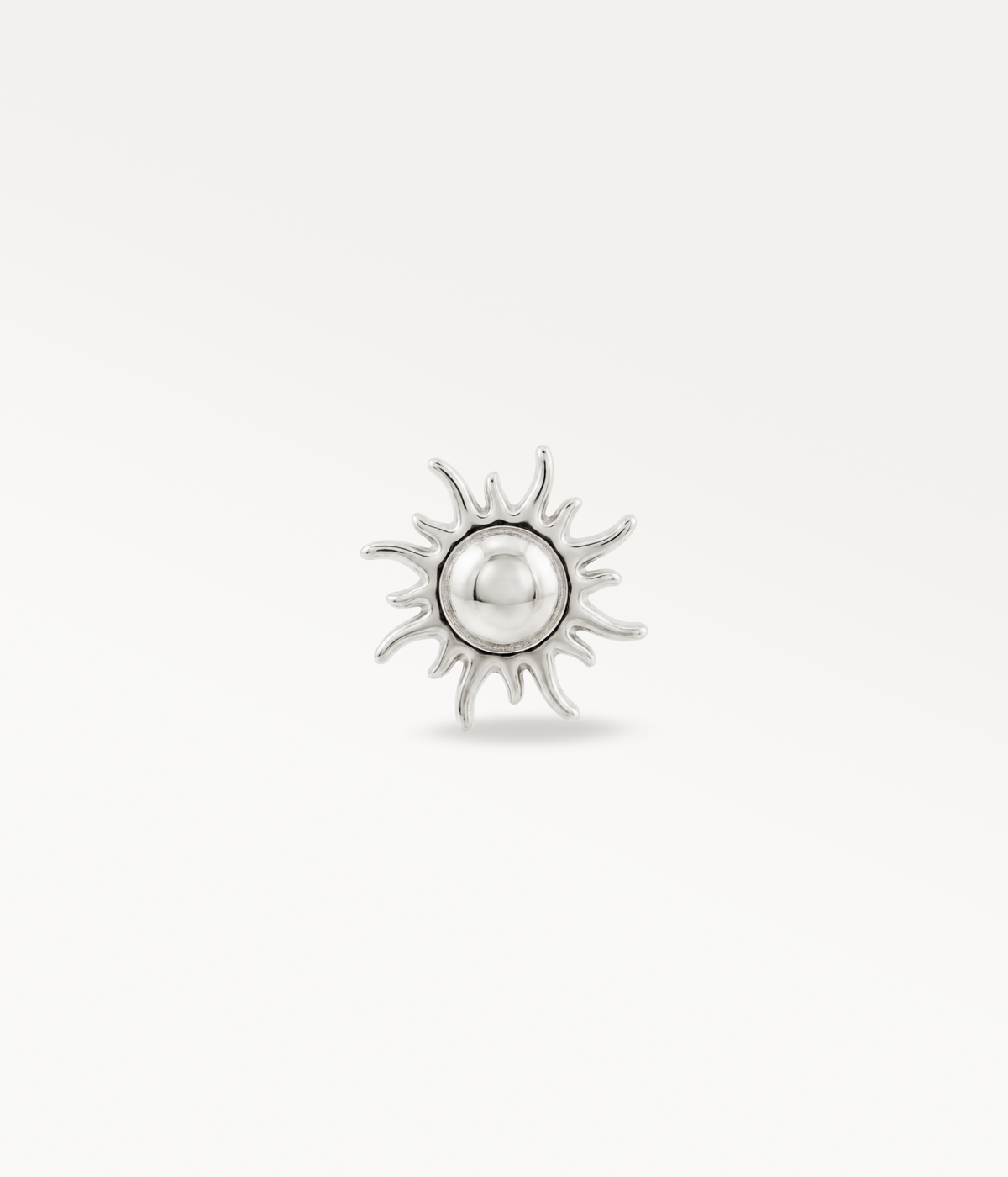 Silver-tone sun-shaped Helios with a round centre and wavy rays, front view.