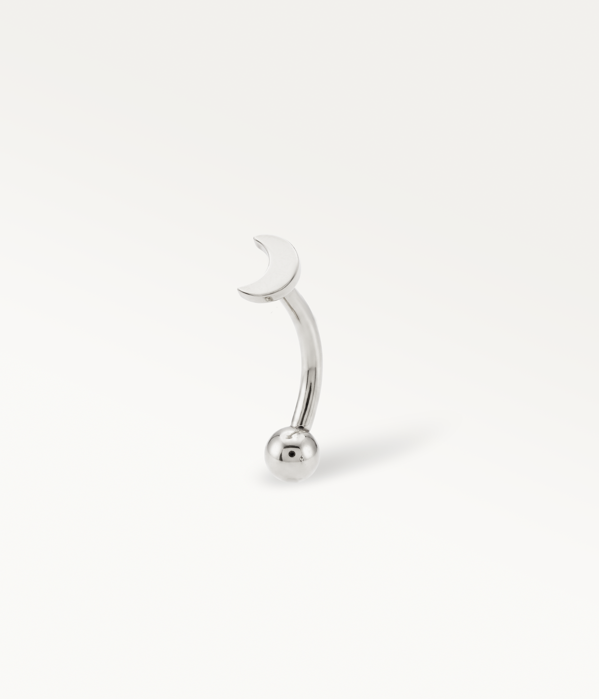 Silver-tone Elara Banane, smooth crescent moon on a curved post, three-quarter view.