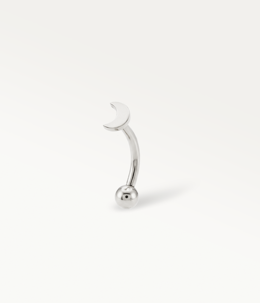 Silver-tone Elara Banane, smooth crescent moon on a curved post, three-quarter view.