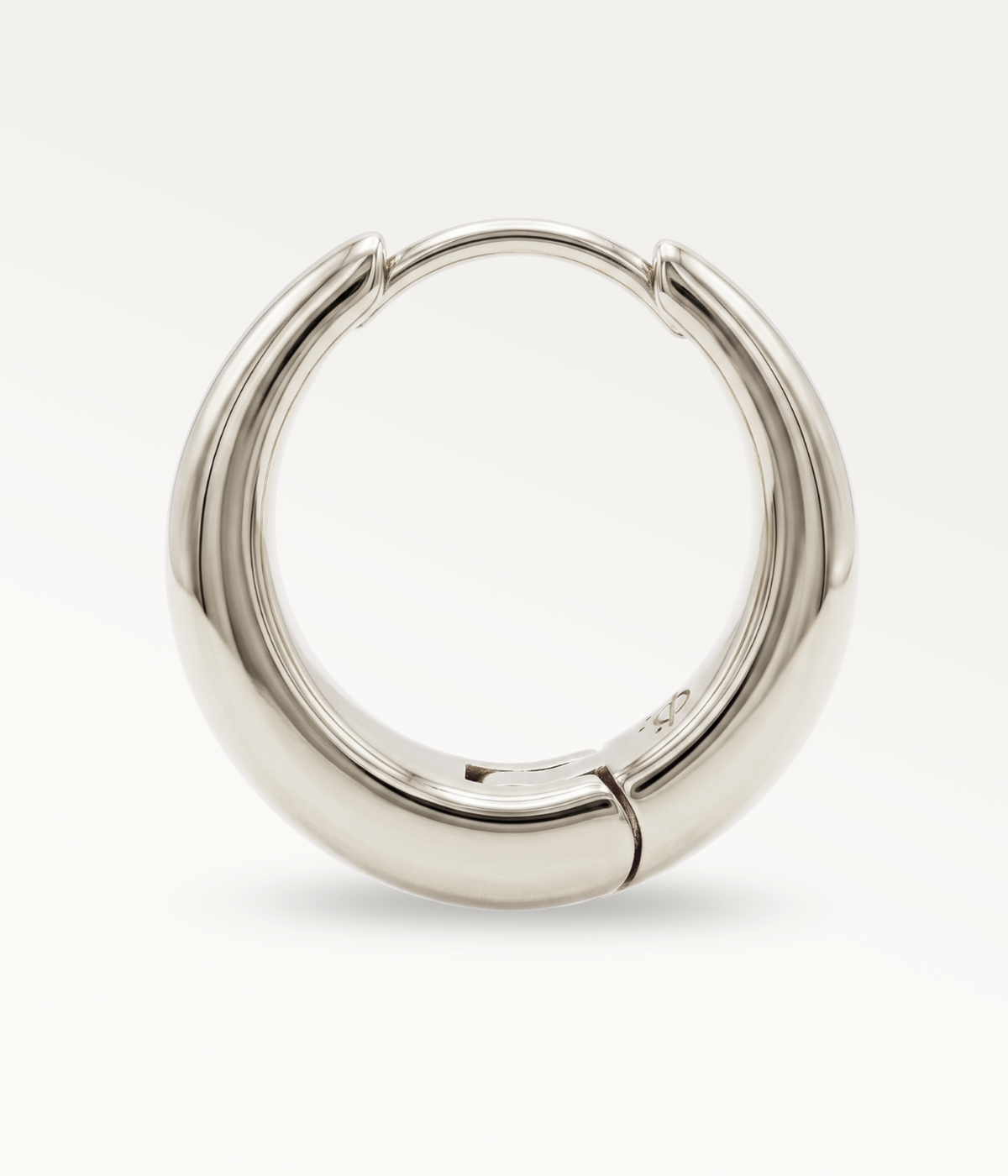 Large silver-tone Soline hoop earring, side view of the hoop and closed clasp.