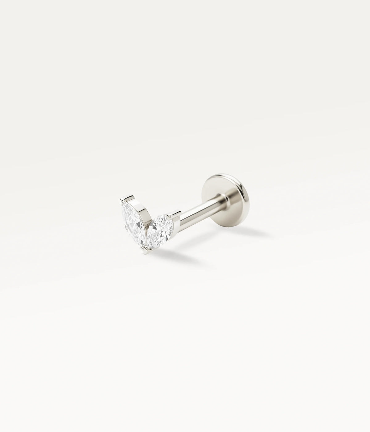 Silver-tone piercing jewellery with a sparkling two-petal motif, a delicate, refined design