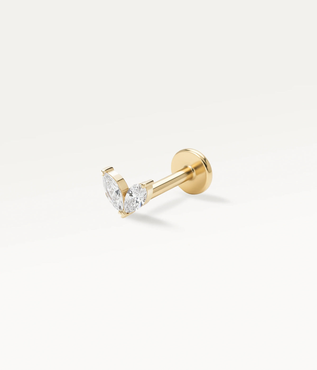 Gold-tone piercing jewellery shaped as two petals set with sparkling zircons