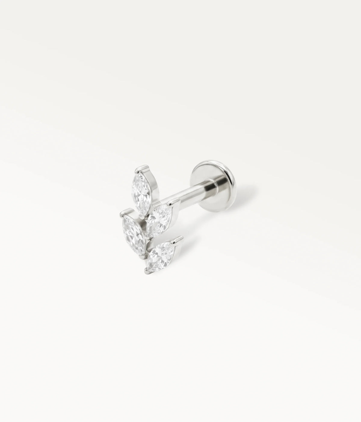 Silver-tone leaf piercing jewellery with marquise-shaped crystals, titanium cartilage jewellery in perspective