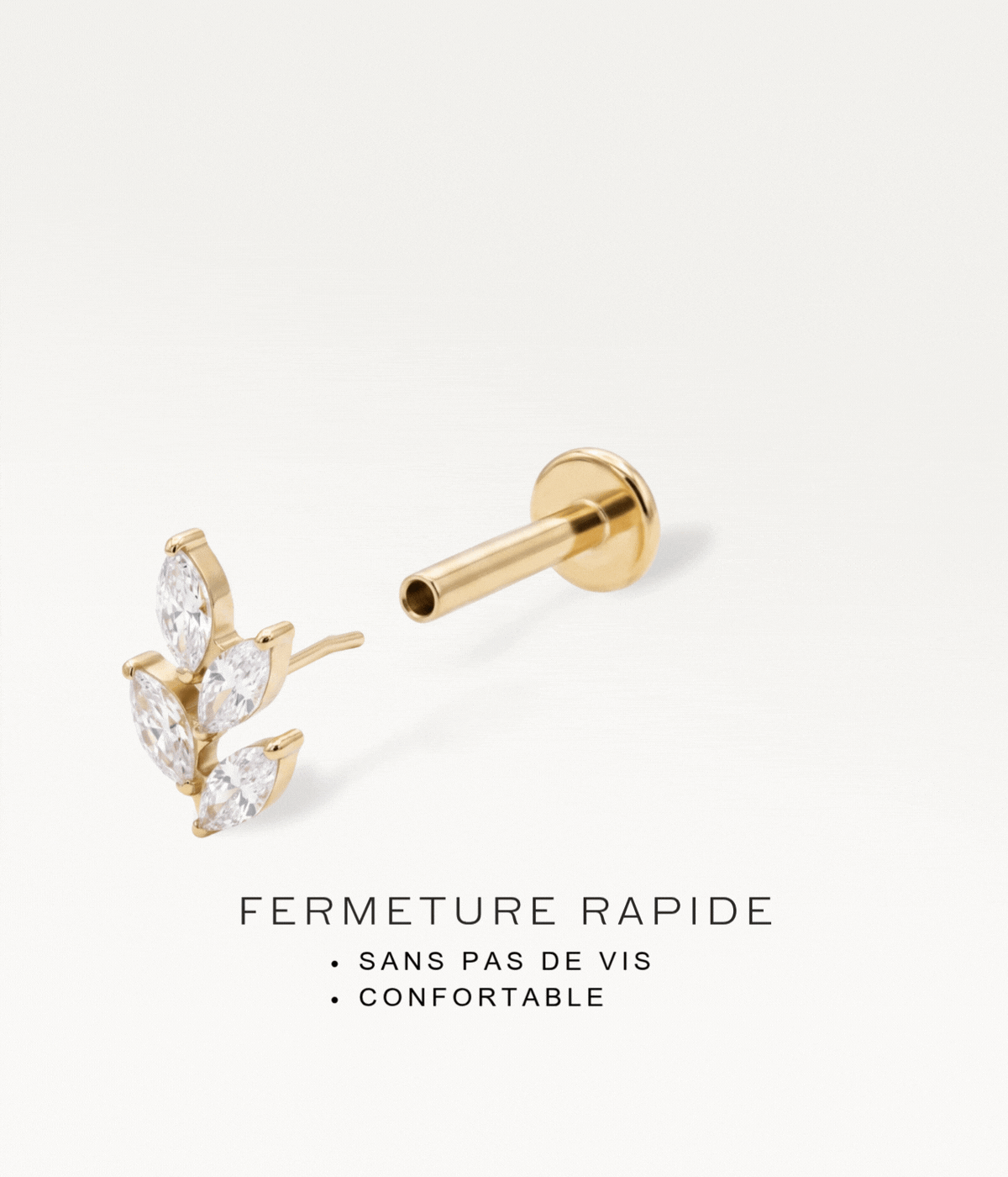 Gold-tone leaf piercing jewellery with a threadless system, demonstrating the quick fastening without screws