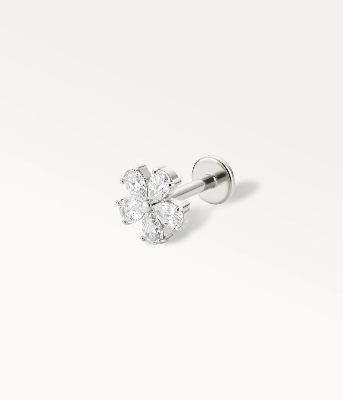 Silver-tone camellia flower piercing jewellery set with marquise-shaped crystals, cartilage jewellery in perspective