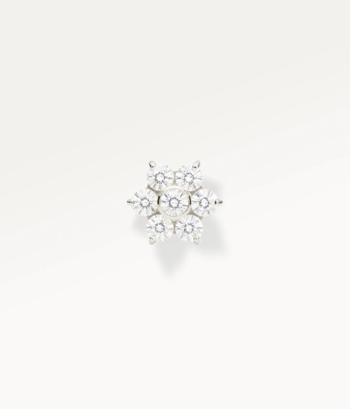 Silver-tone flower piercing jewellery with sparkling stones, a radiant, feminine piece
