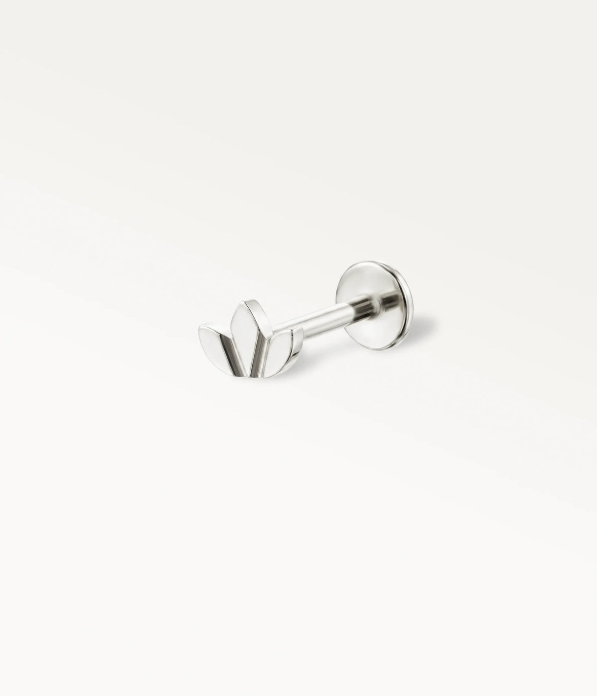 Silver-tone titanium lotus flower piercing jewellery, elegant cartilage jewellery in side view