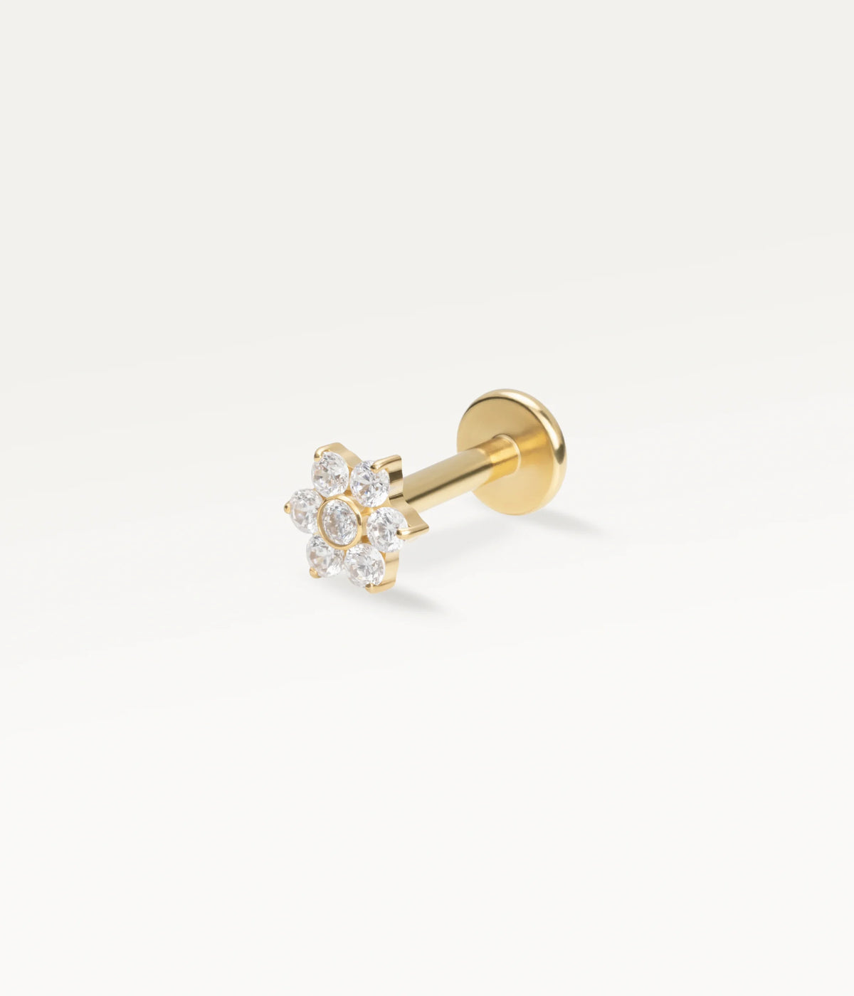 Gold-tone flower piercing jewellery set with zircons, a delicate piece for the ear