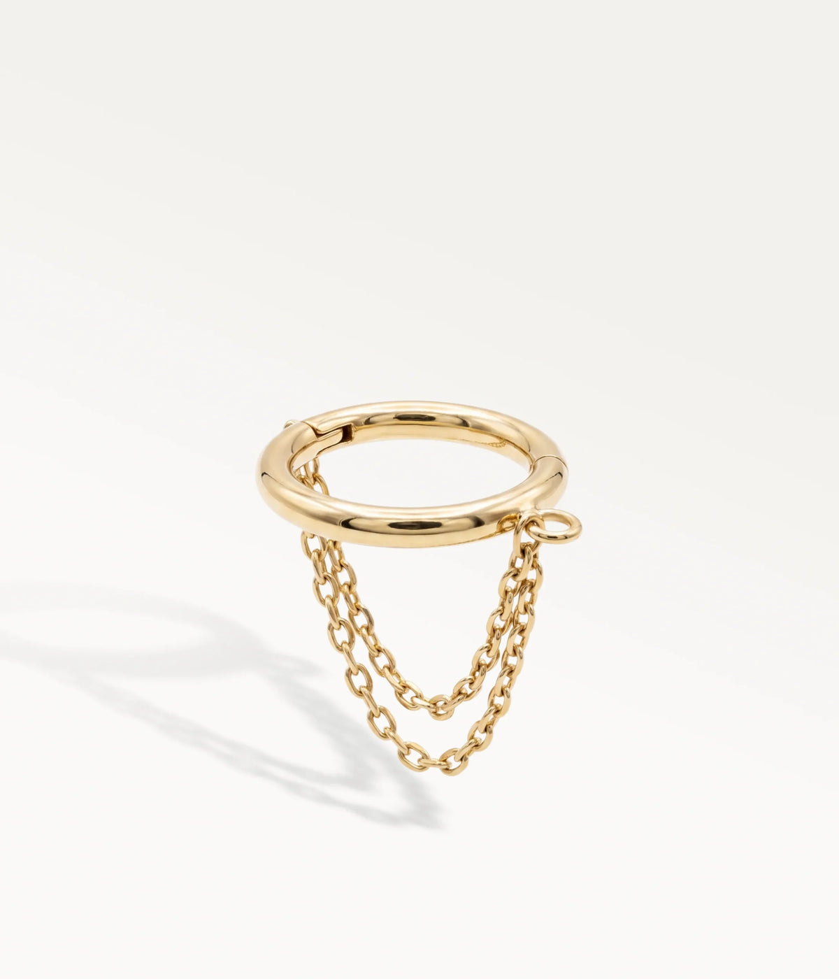 Gold-tone helix jewellery adorned with two delicate chains connected to the hoop