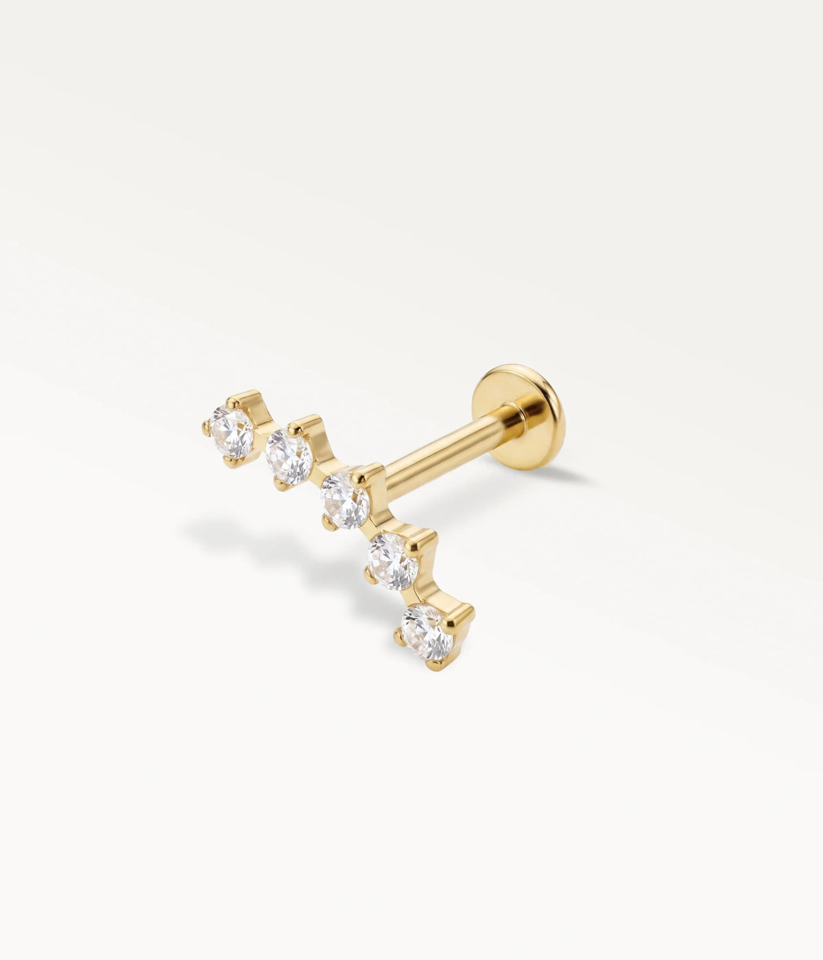 Gold-tone Sillage helix jewellery with 5 sparkling crystals in a row, chic cartilage jewellery in perspective