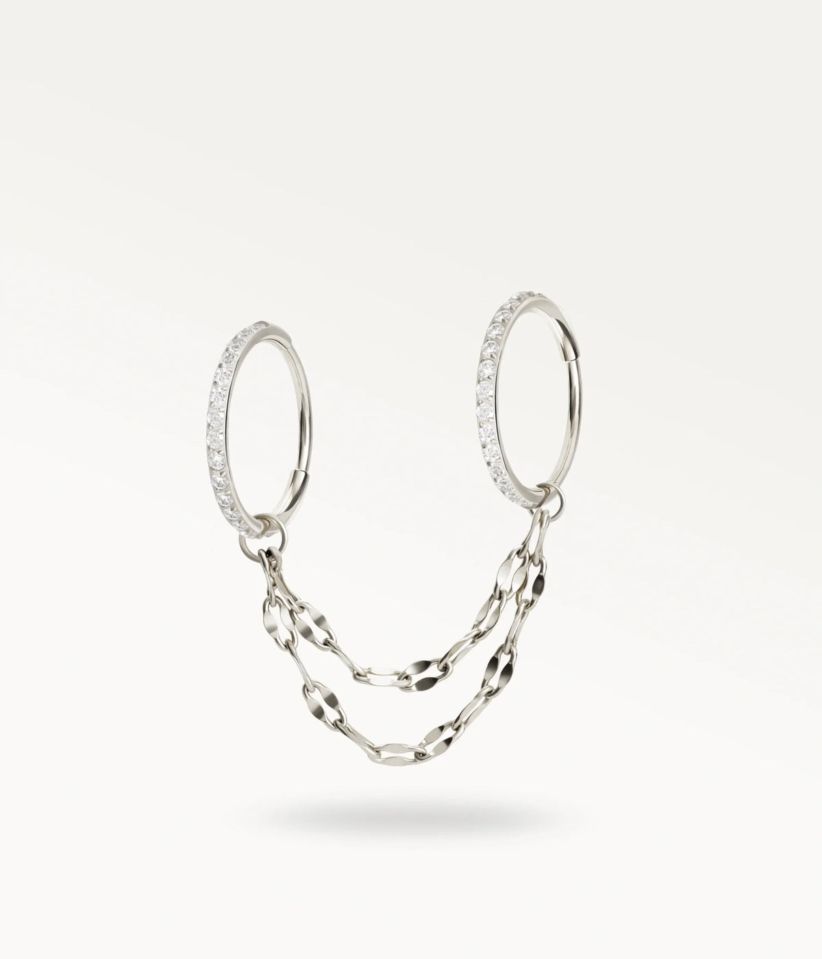Silver-tone Nexus, two stone-set hoops linked by two flat-link chains.