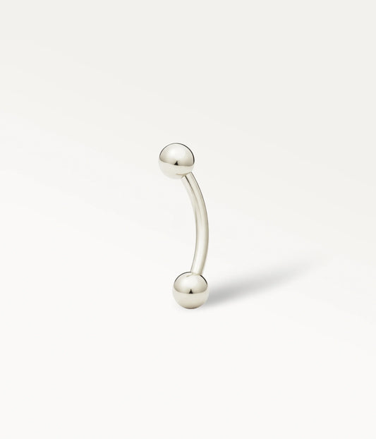 Silver-tone Bérénice curved barbell with two smooth ball ends.