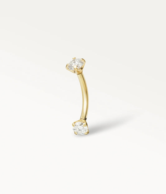 Sceptre doré, tige courbe terminée par deux pierres rondes, vue de trois quarts.