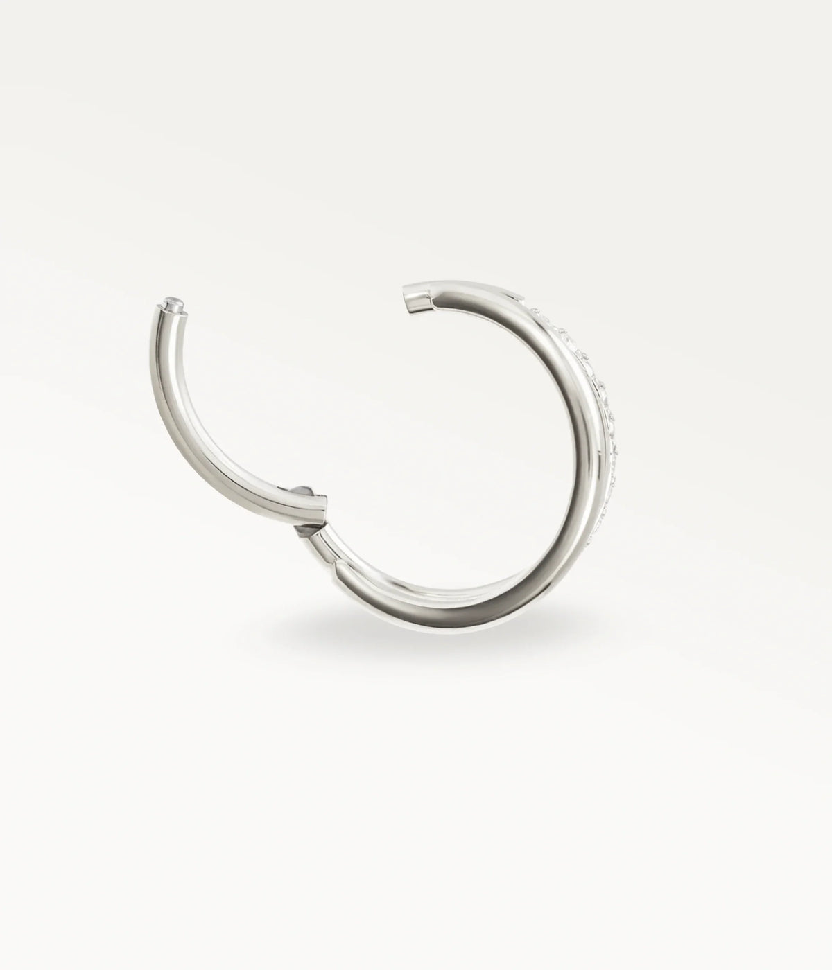 Open silver-tone Mirage hoop showing the hinged fastening.