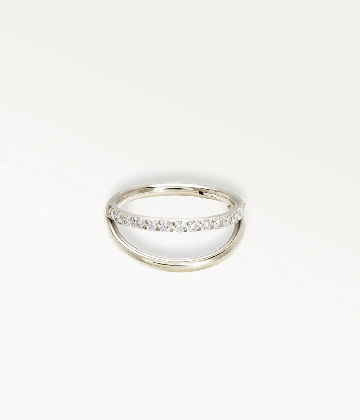 Silver-tone Mirage hoop with two rows, the upper row set with stones.
